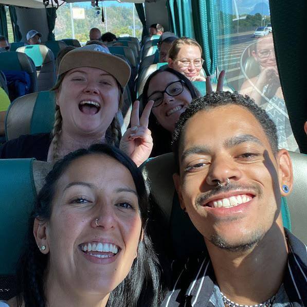 people in a bus smiling in a selfie